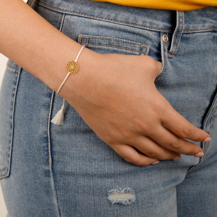 Model with String Bracelet and Gold Charm