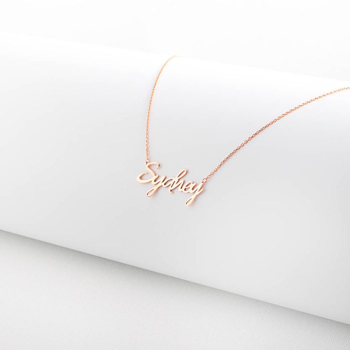Rose Gold Necklace on White Prop